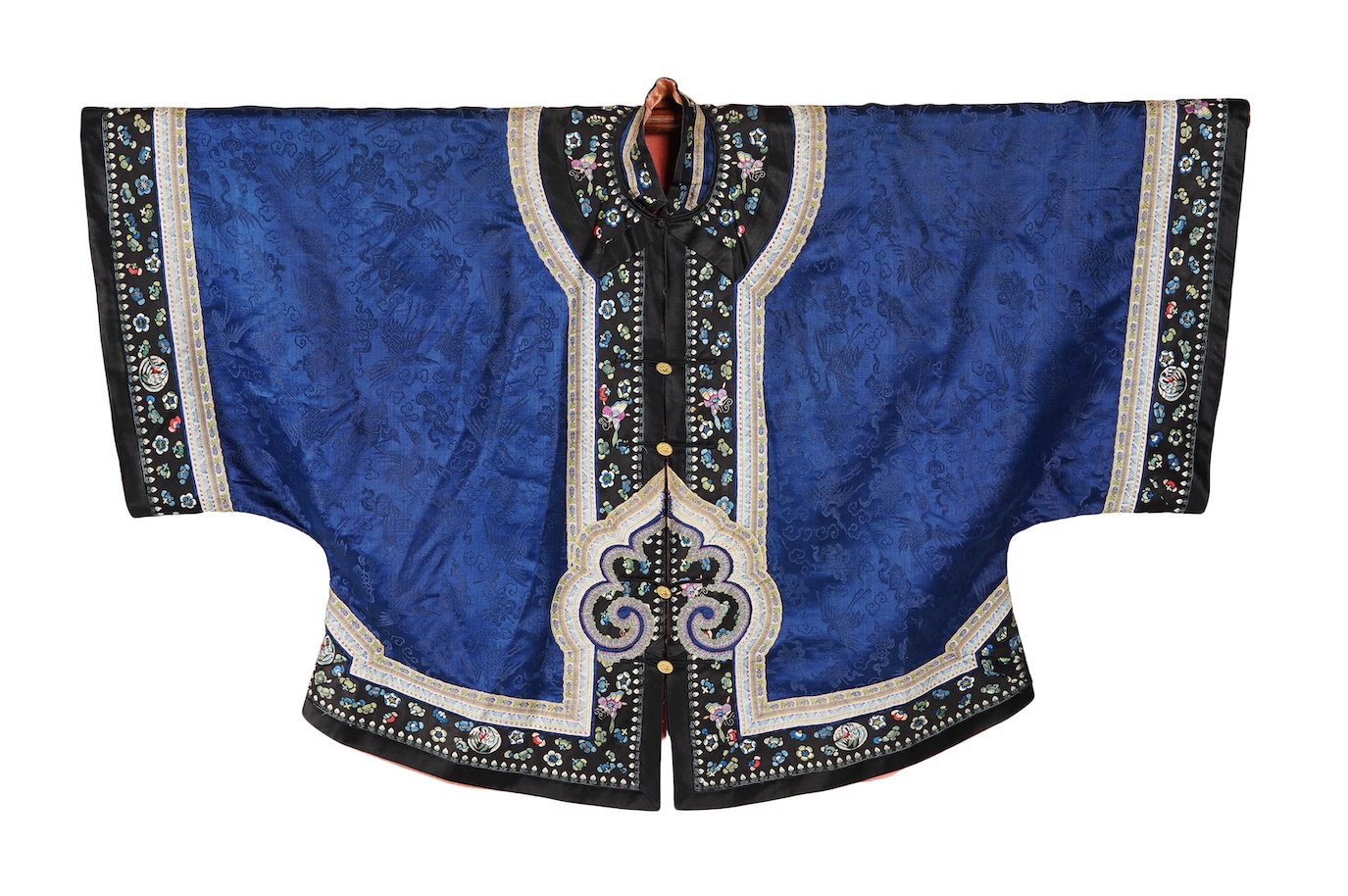 A late 19th century Chinese blue silk damask jacket, woven with Phoenix and auspicious symbols. The jacket edged with ornate rows of braiding and silk embroidery, the interior with original pink silk lining. The jacket f